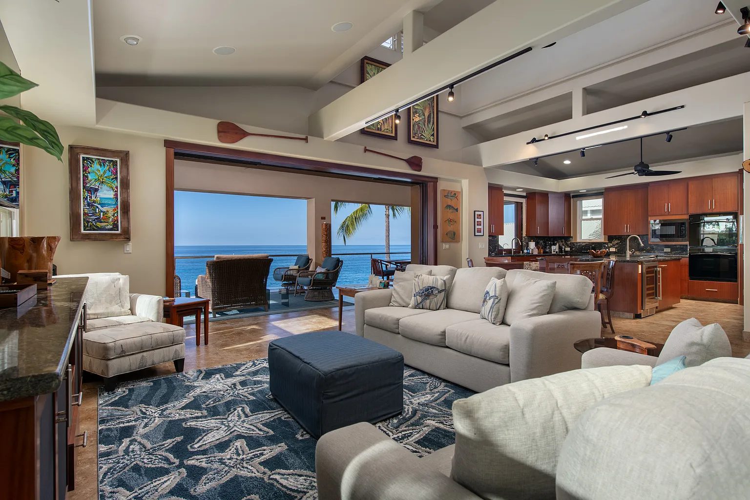 Great room opening to an oceanfront lanai at a Kailua-Kona luxury home