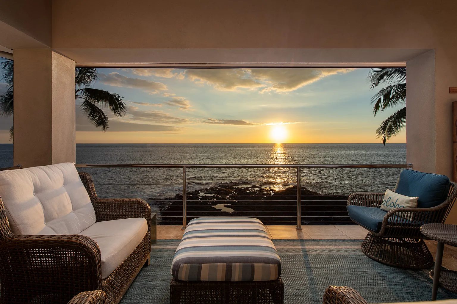 Sunset over the ocean from the covered lanai of a Kailua-Kona luxury home