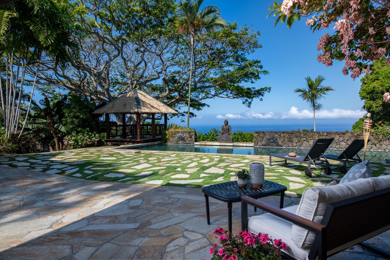 Pool terrace and garden pavilion with ocean views at a Holualoa luxury estate